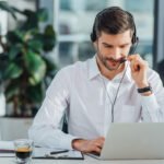 Interpreter with headset and notebook.
